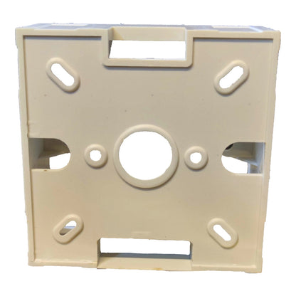 An off-white plastic mounting bracket or frame with various cutouts and slots, shown against a plain white background.