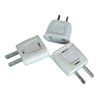 Three white plastic US to European plug adapters with two metal pins, shown on a plain white background.