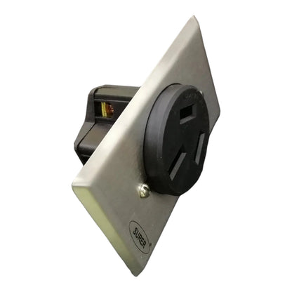 A SURFEST brand marine electrical outlet with a black 3-prong plug inserted into a square silver metal faceplate, shown on a plain white background.