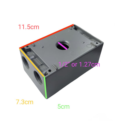 A gray plastic electrical junction box shown on a white background with colored dimension lines and labels indicating measurements: 11.5 cm, 7.