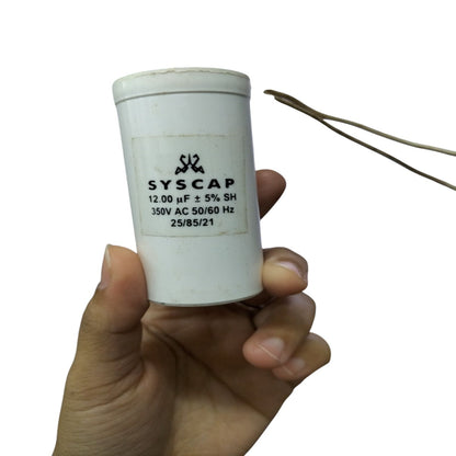 Syscap 12UF Motor Running Capacitor held in hand for electrical circuitry and motor applications