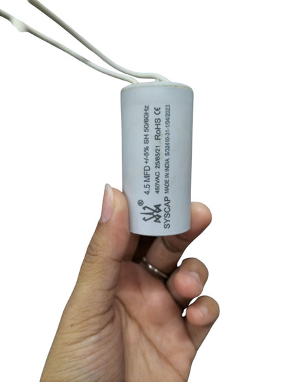 Syscap 450vac Motor Running Capacitor held in hand, used for improving motor efficiency