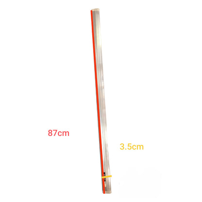 Long thin metallic rod with measurements on a white background