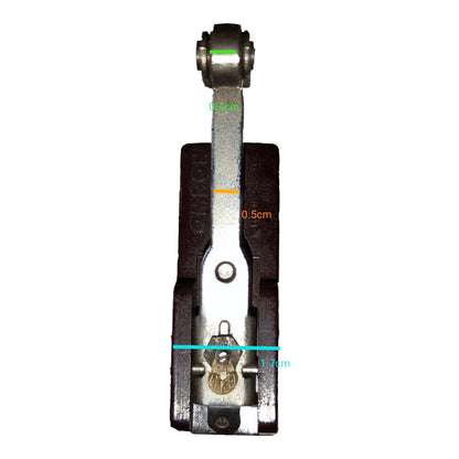 A close-up of a metal and dark brown mechanical component with overlaid dimension lines and text labels reading 0.5cm, 1.