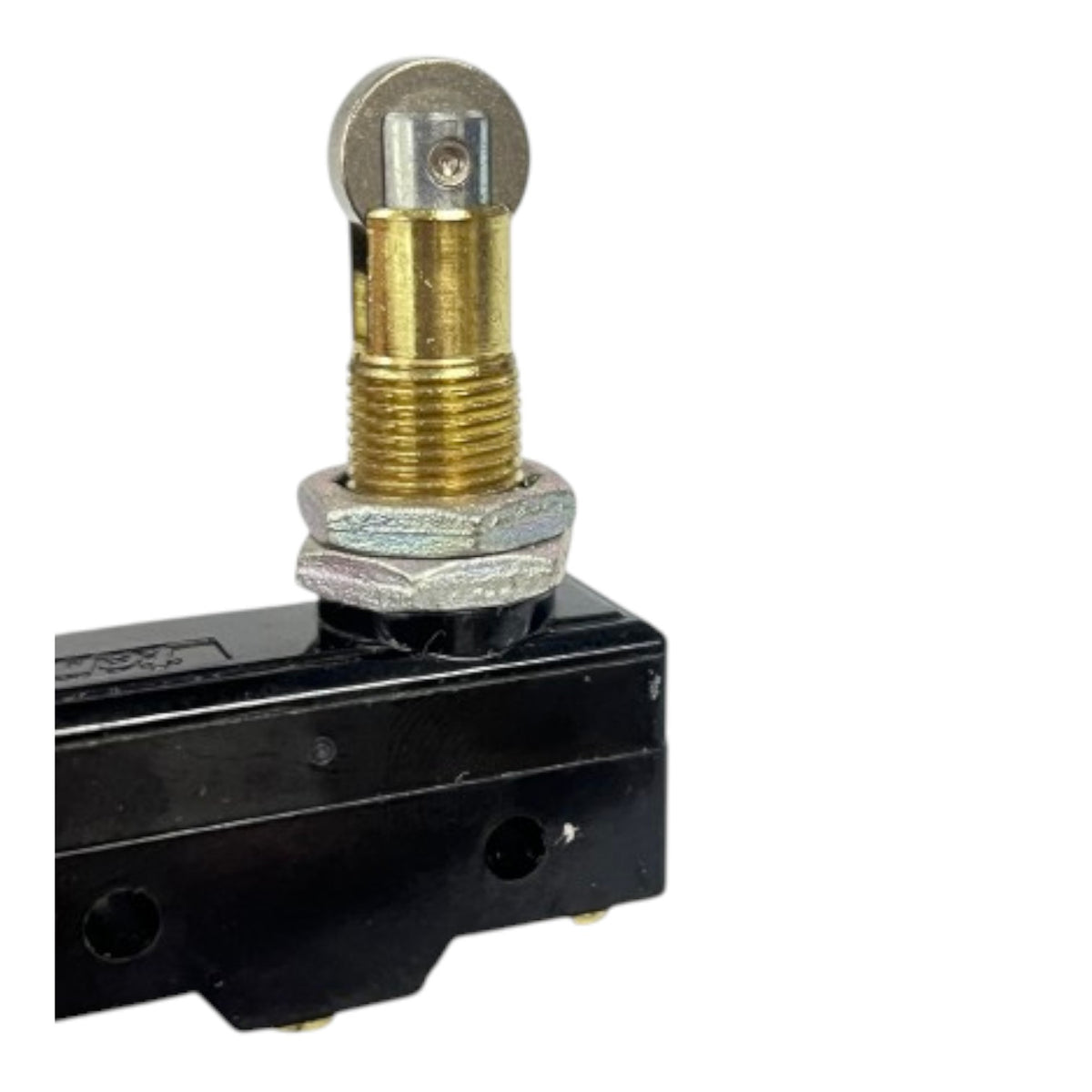 A close-up of a mechanical switch or valve component featuring a black plastic housing, a silver hex nut, a brass cylindrical post, and a round silver metal cap on a white background.