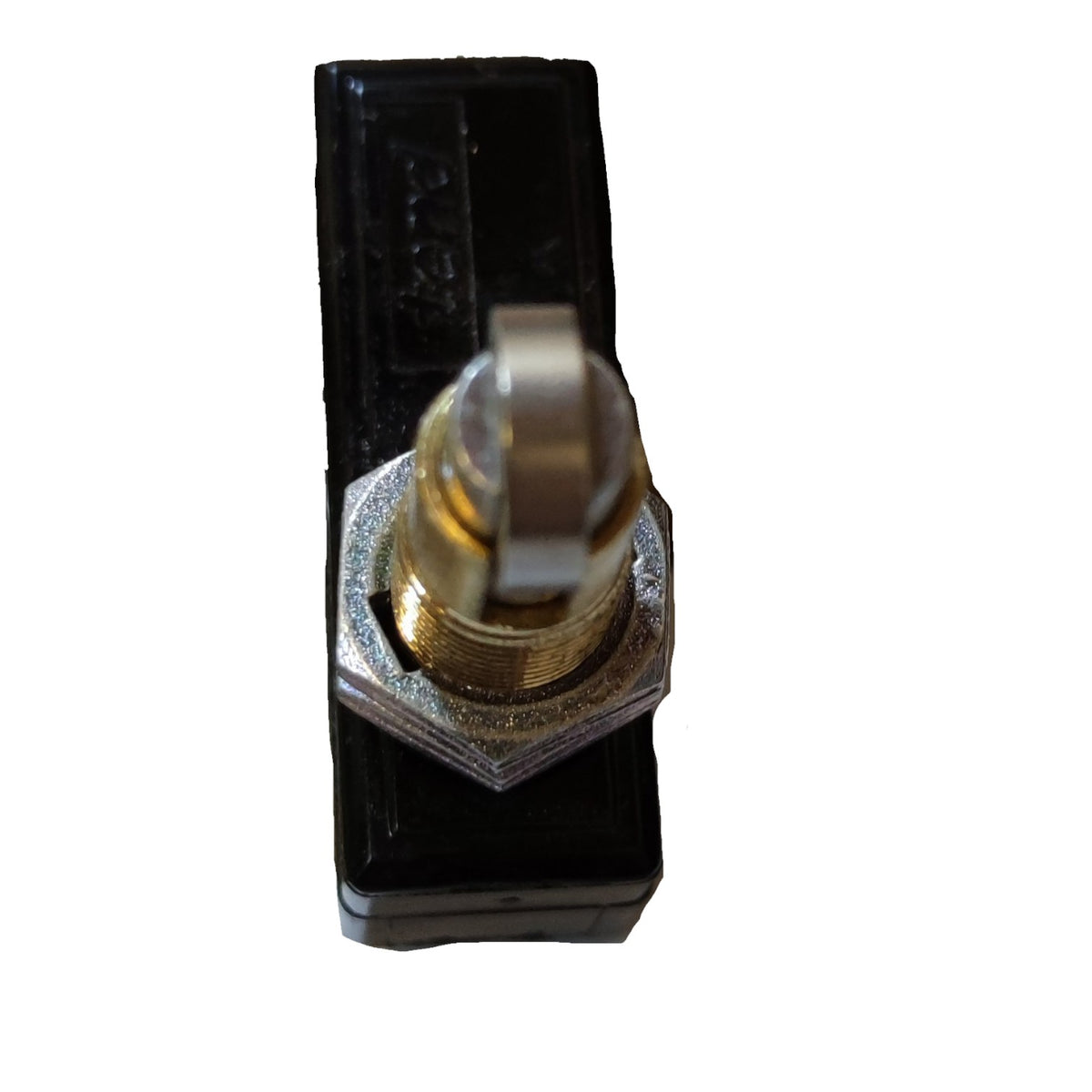 A small black plastic toggle switch with a brass and silver metal knob, isolated on a white background.