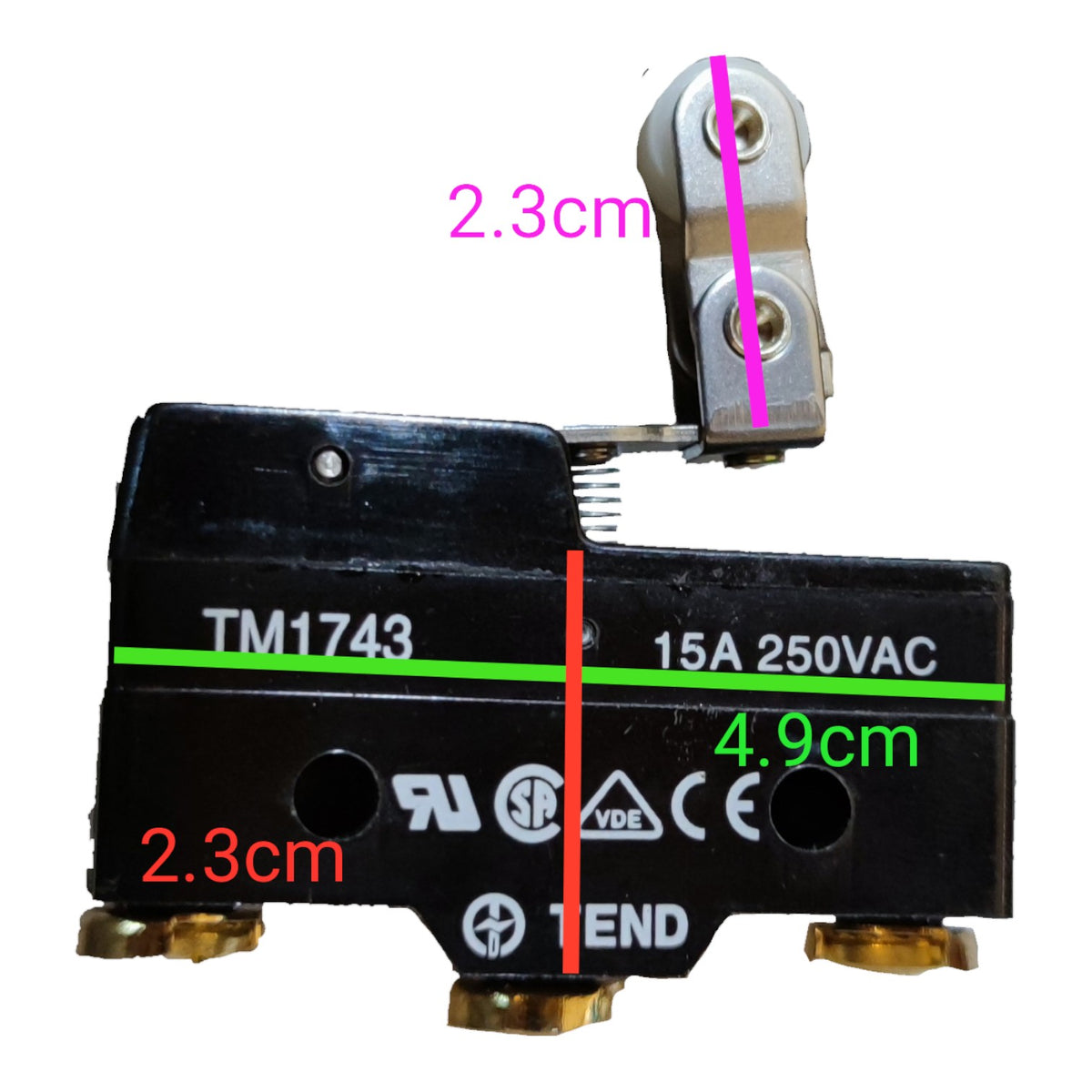 A black electrical relay component with gold-toned terminal ends and printed text including TM1743, 15A 250VAC, and dimensions in pink, green, and red measurement labels on a white background.