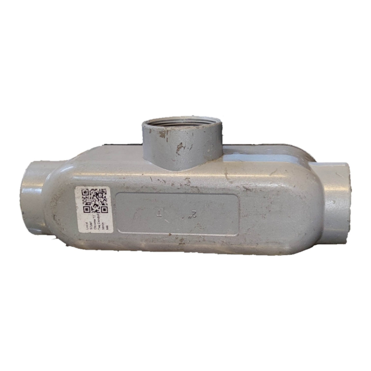 Metal pipe fitting with a QR code label on a white background