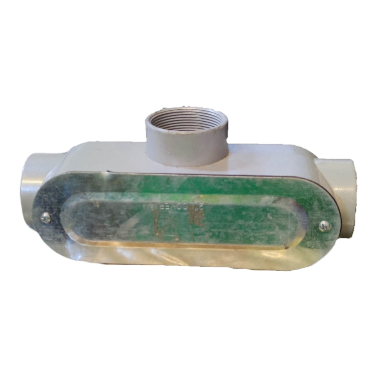 Metal fitting with a green label on a white background