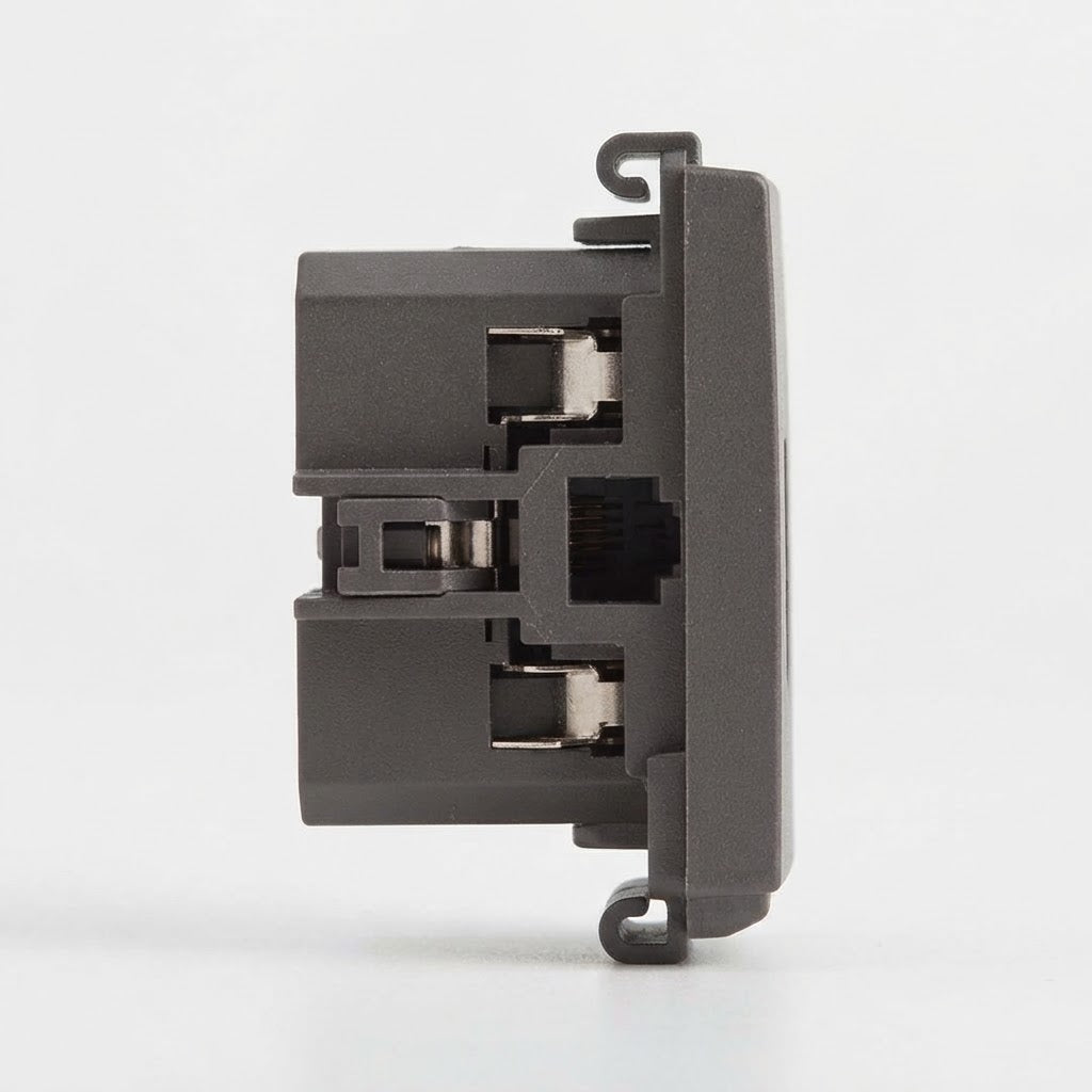 A close-up side view of a dark gray plastic electronic component or connector module on a clean white background.