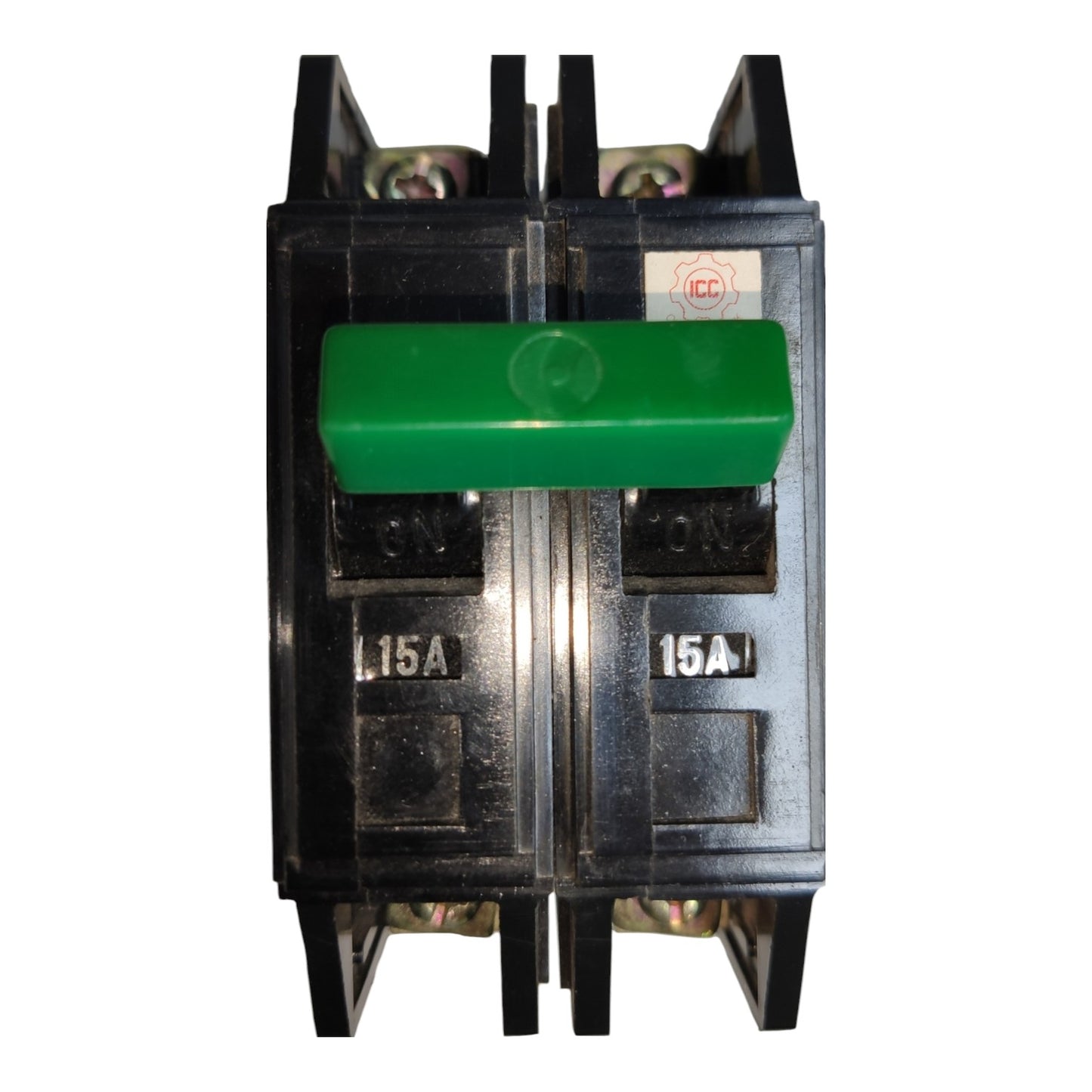 A 15A double-pole electrical circuit breaker with a prominent green handle on a black plastic housing, shown against a plain white background.