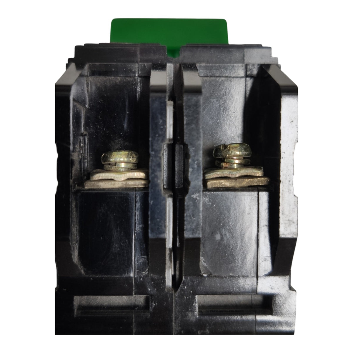 A close-up of a black electrical terminal block connector with two metal screw terminals and a green plastic tab visible at the top, isolated on a white background.