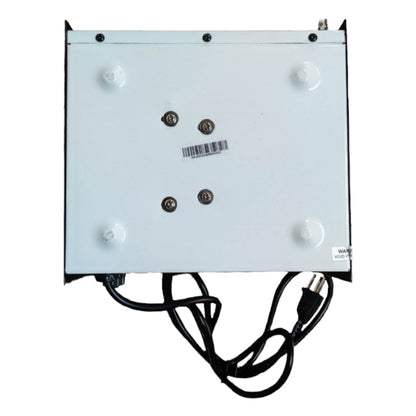 White electronic device with black cables on a white background