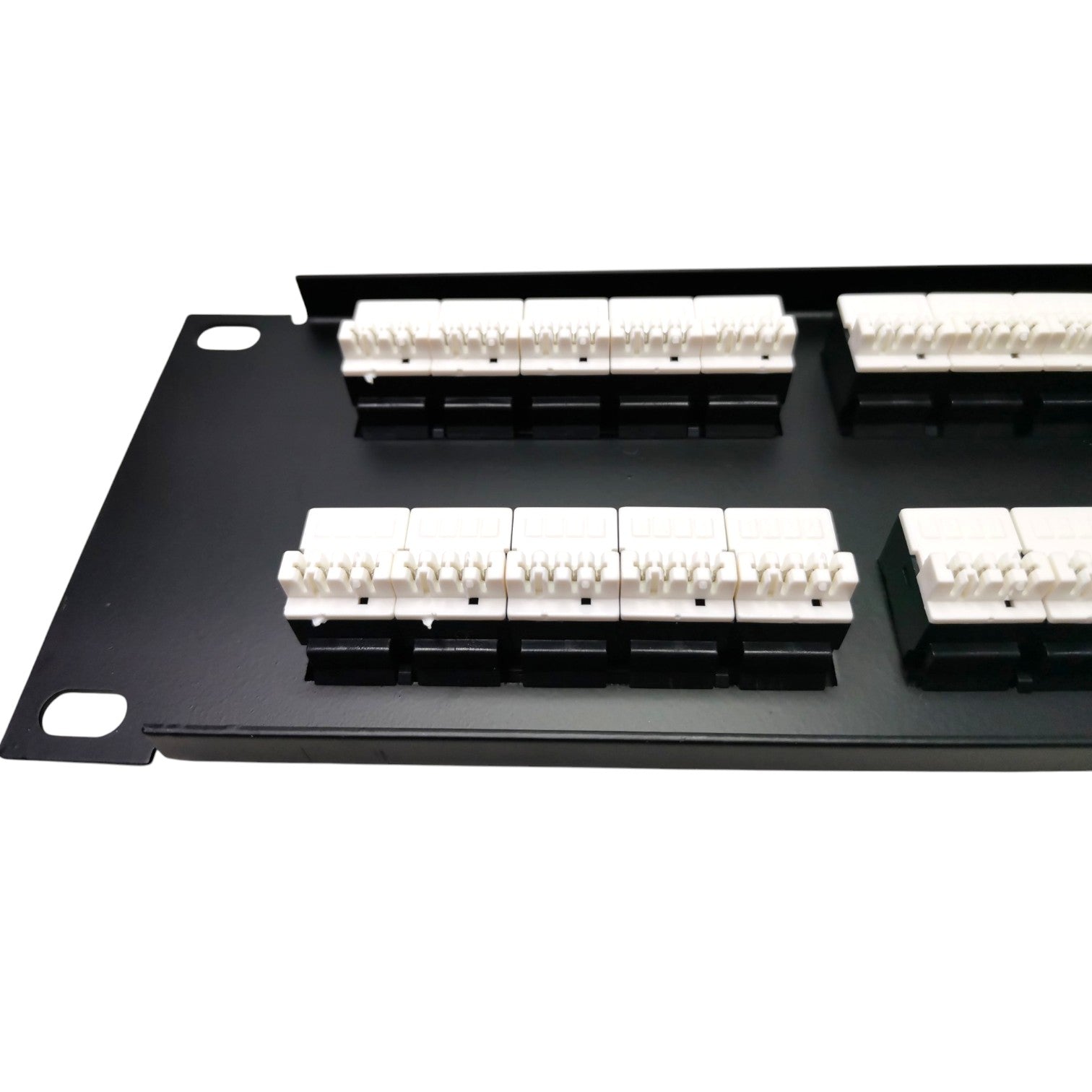 Black metal patch panel with multiple white RJ45 network interface connectors arranged in rows on a white background.