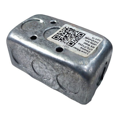A galvanized metal junction box with pre-drilled screw terminals and a white product label featuring a QR code, shown on a plain white background.