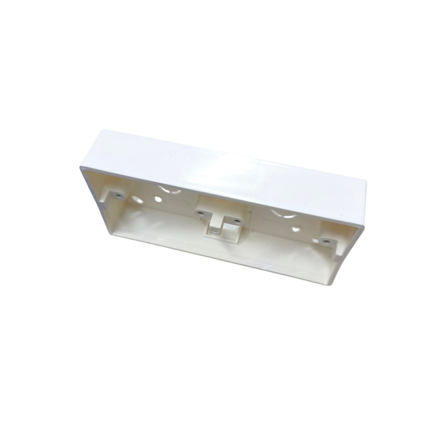 Metallic rectangular object with a white top on a white background