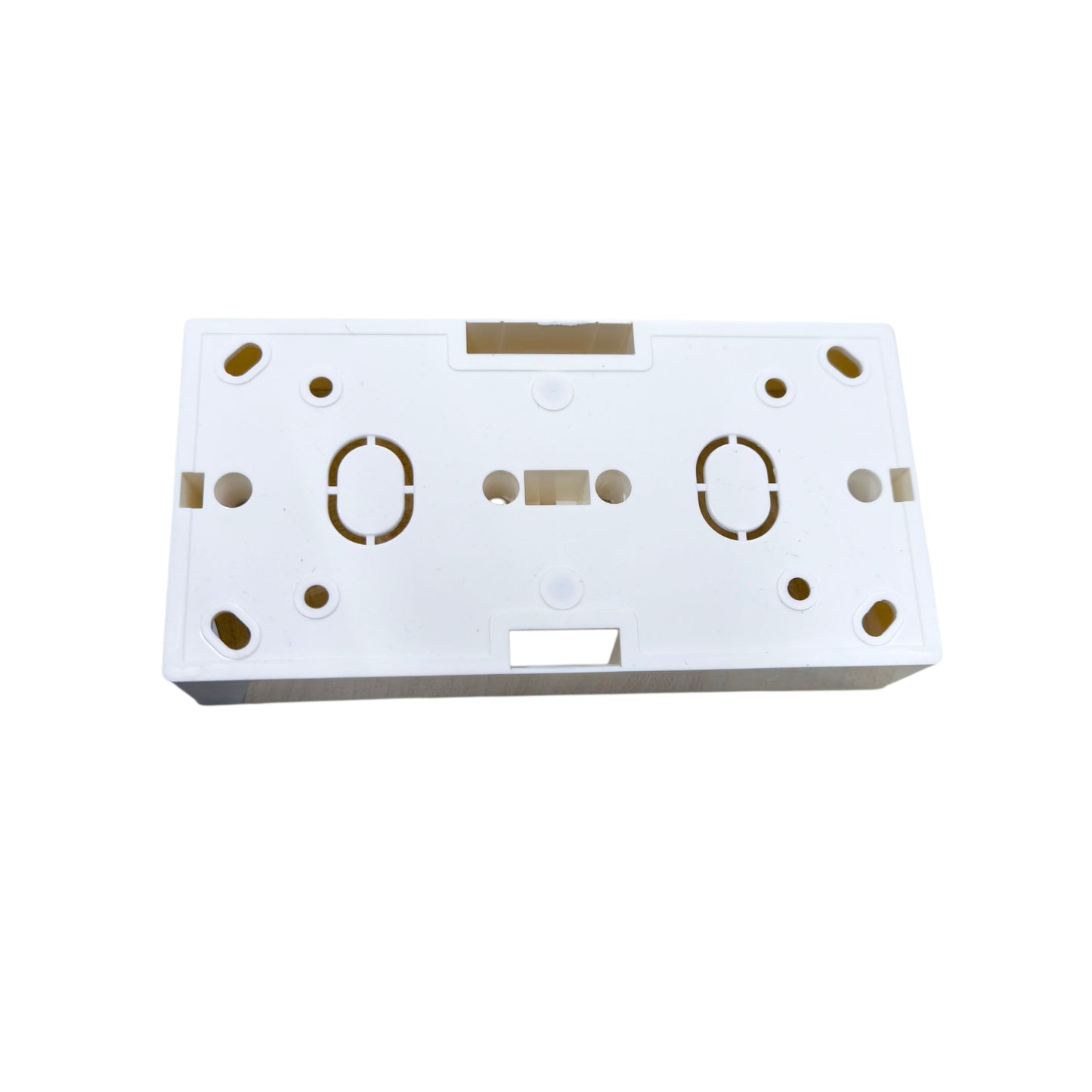 White rectangular object with gold circular patterns on a white background