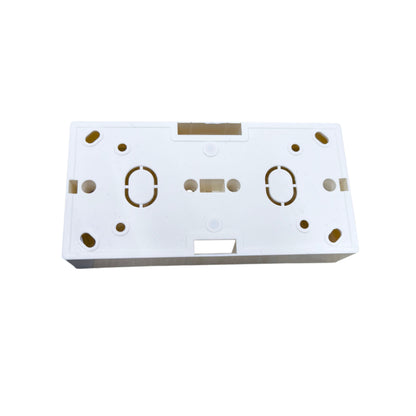 White rectangular object with gold circular patterns on a white background