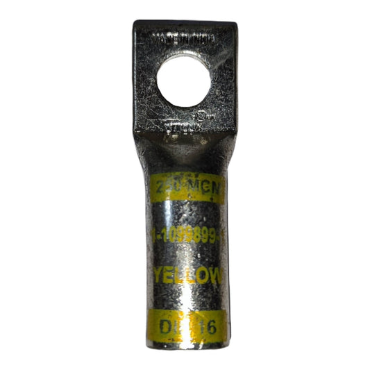 Metal electrical connector with yellow label on a white background