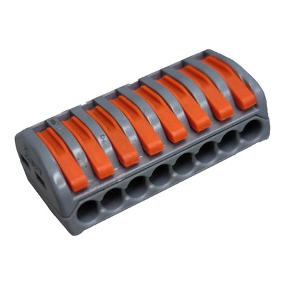 Gray and orange plastic component on a white background