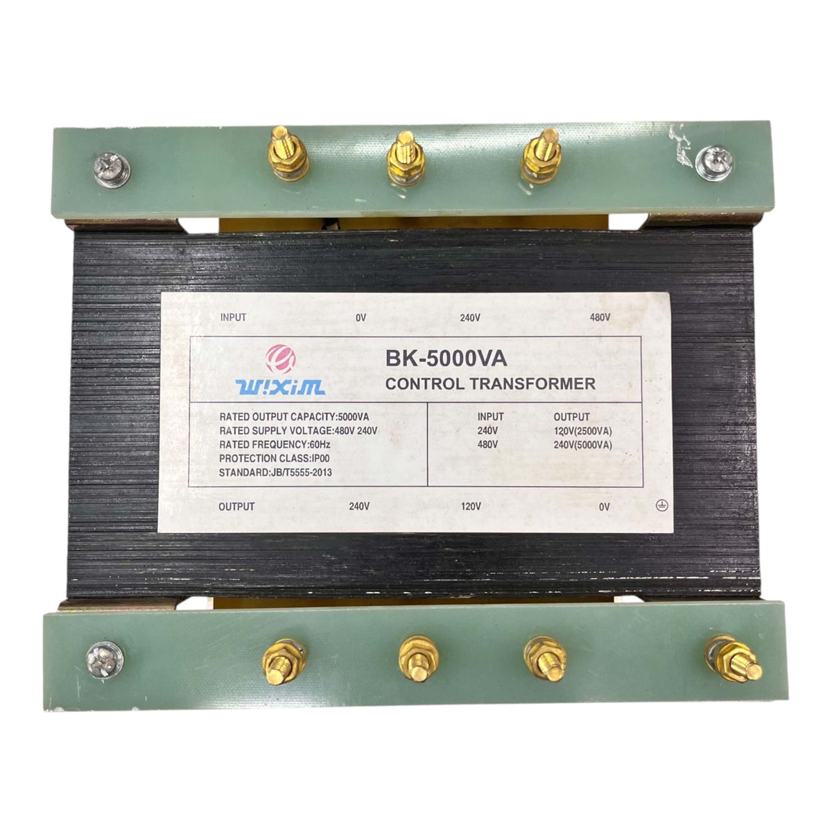 A industrial BK-5000VA control transformer with a black core, green metal end plates, and gold screw terminals, featuring a white specification label.