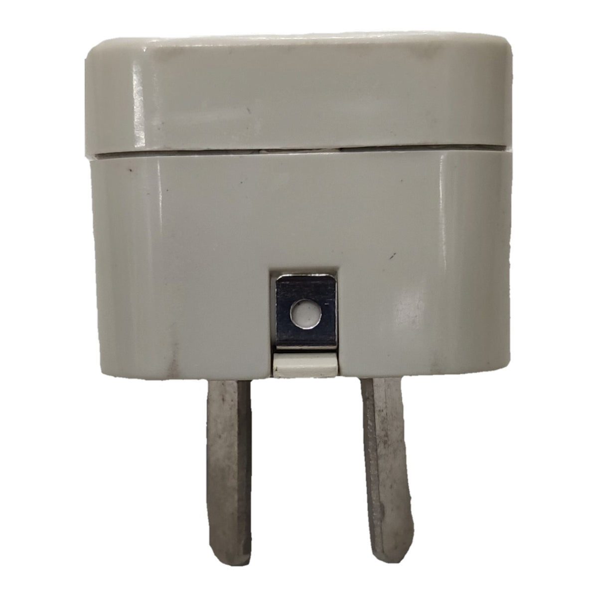 A small rectangular plastic adapter or plug with two metal pins, shown against a plain white background.