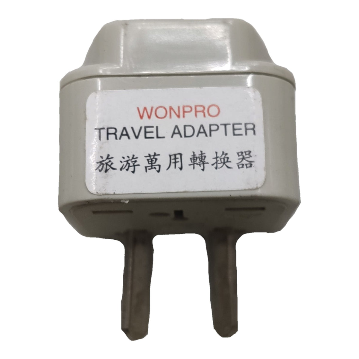 A Wonpro travel adapter plug with two metal pins, featuring a white label with red and black text on a light gray plastic body, isolated on a white background.