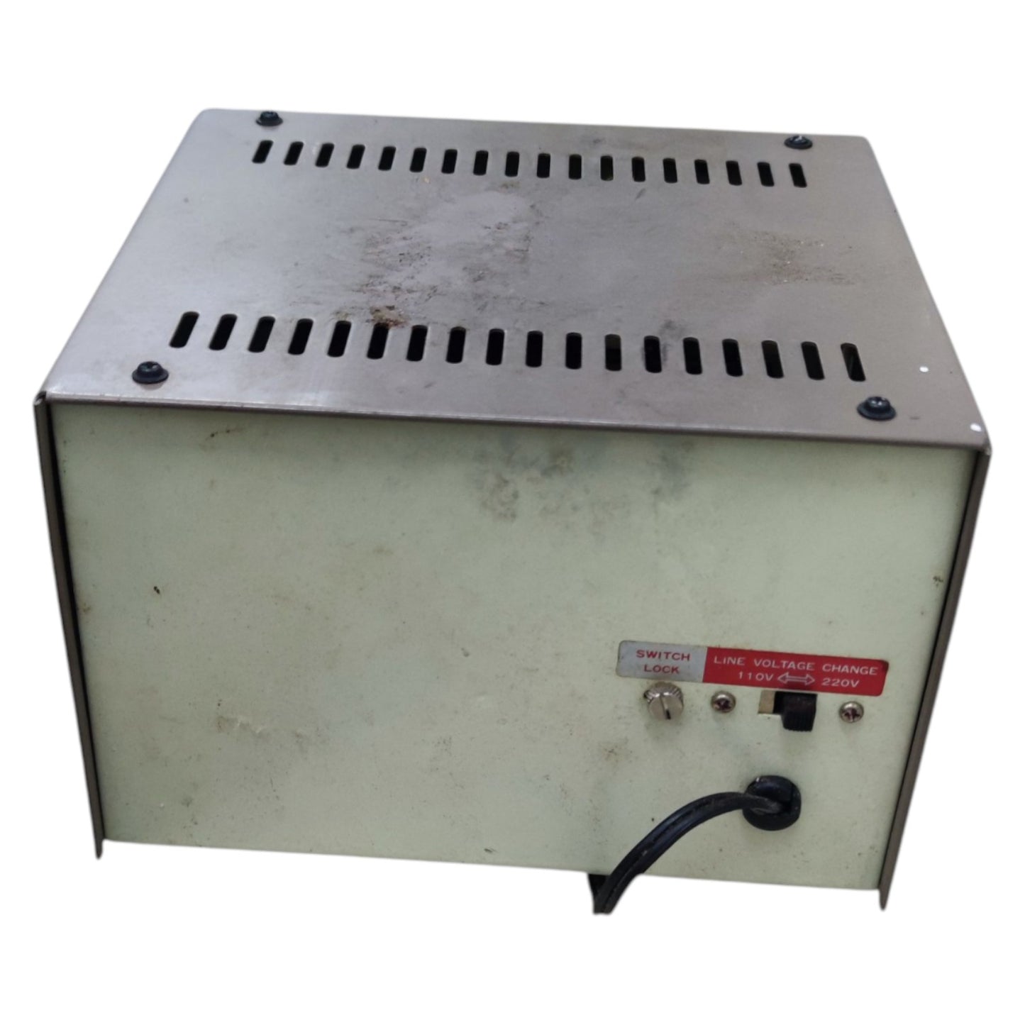Vintage power supply unit with metal top and white base on a white background