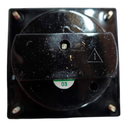 A close-up of a black electrical switch component with four mounting screws, a circular dial, and a small white label marked '03'.