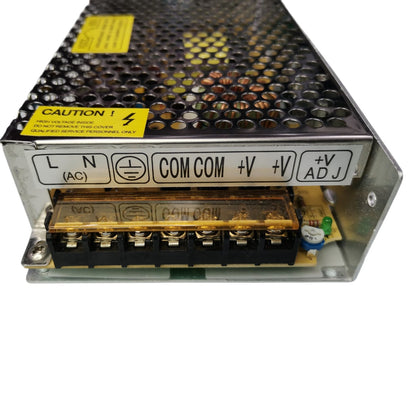 Power supply unit with labeled terminals on a white background