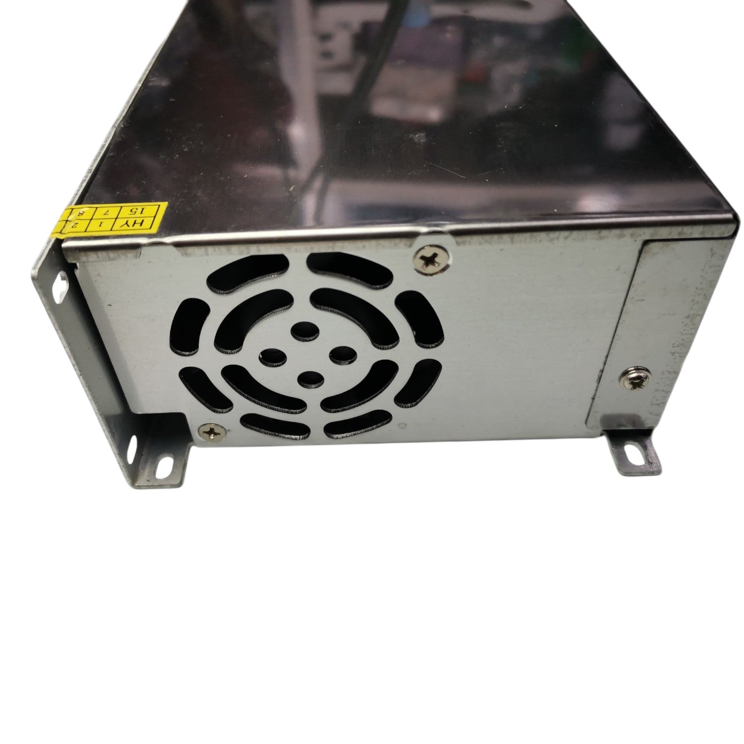 Metal power supply unit with cooling fan on a white background