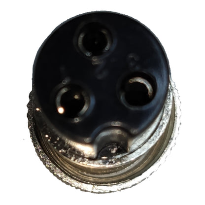 A close-up of a circular black electrical connector with three pin holes and a textured metallic silver base, isolated on a white background.