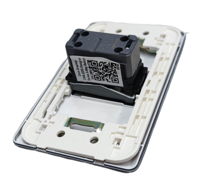 Omni 3 way switch graphite internal module in white wall plate showing QR code and mounting clips