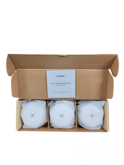 Aegislink wireless interlinked smoke alarm set with three alarms in an open cardboard box