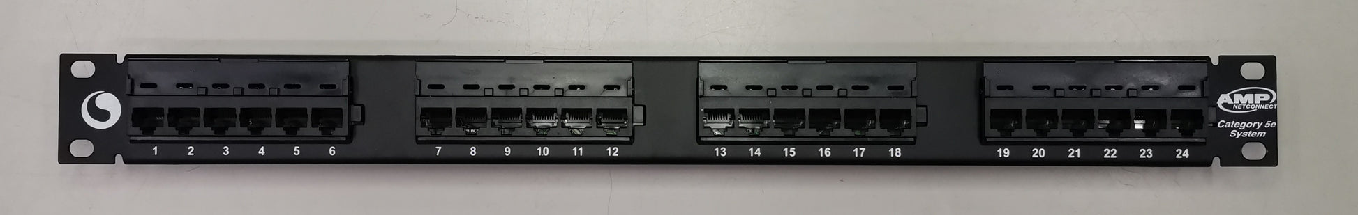 AMP CAT5E patch panel 24 port with black ports and labeled connection slots for network management