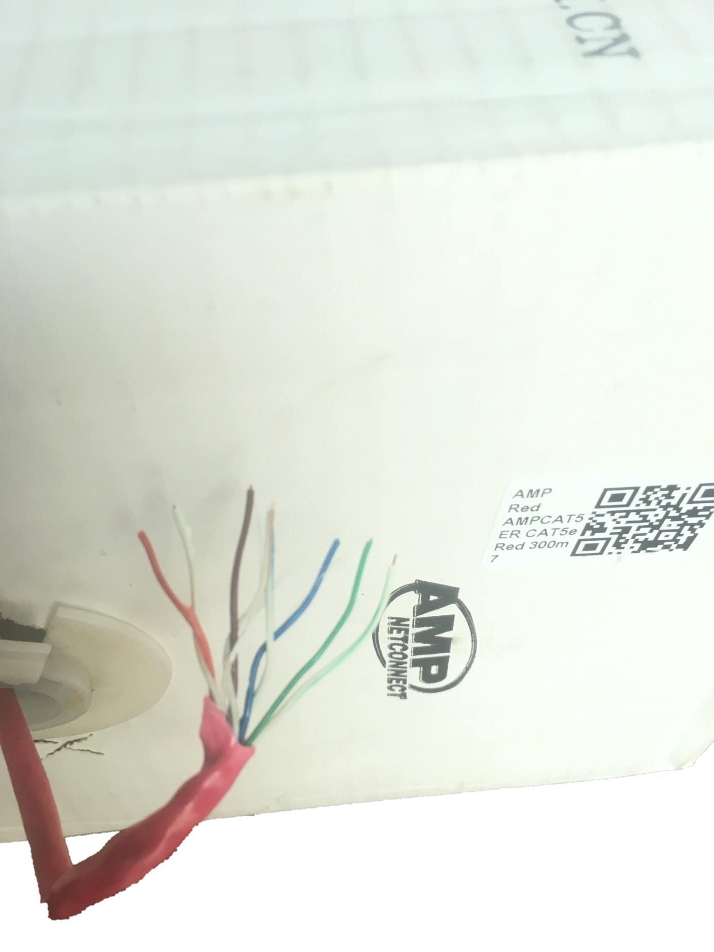 Close-up of AMP CAT5e UTP LAN Cable 300 Meters showing exposed internal colored wires