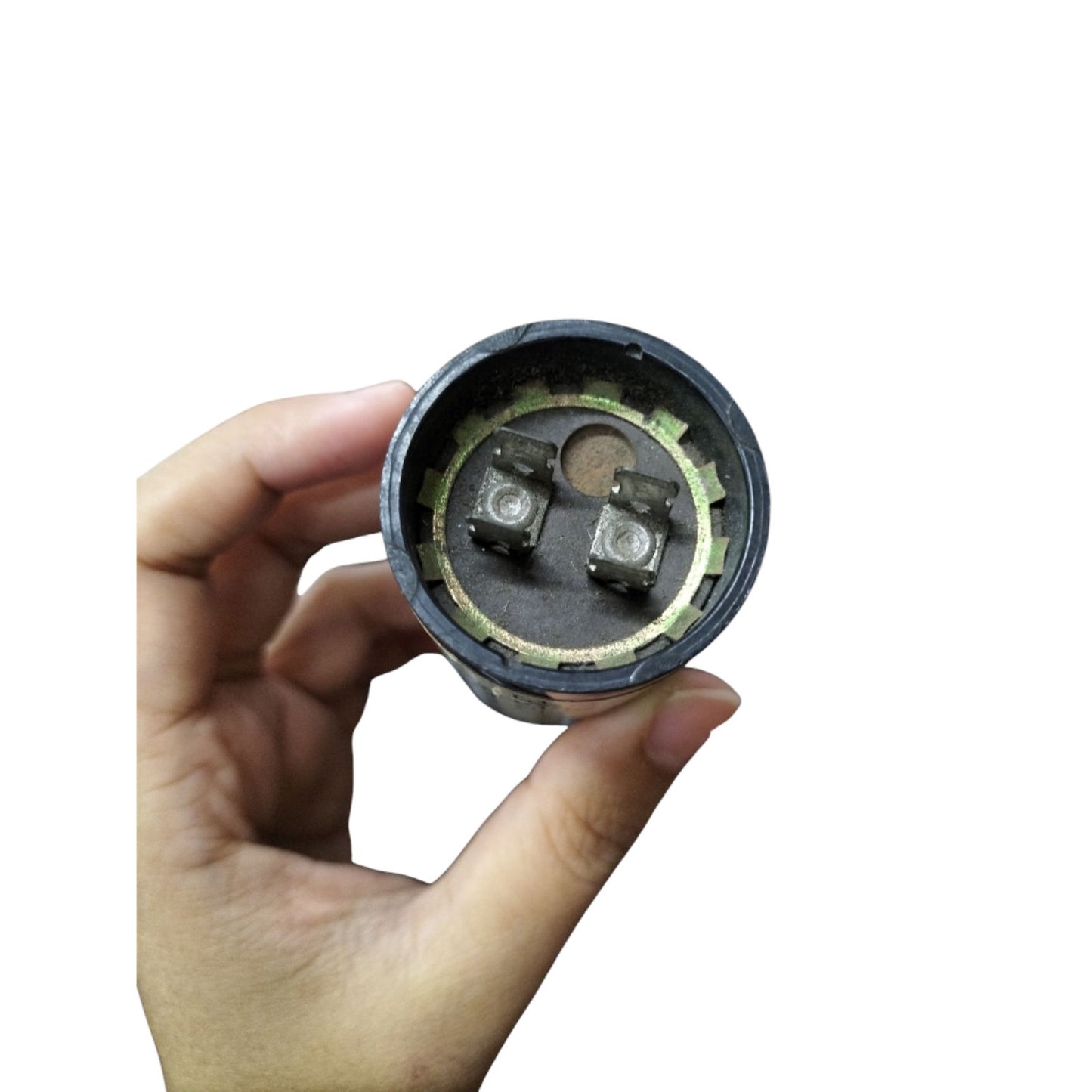 BC Motor Starting Capacitor 21-25uF 250V held in hand showing terminals clearly