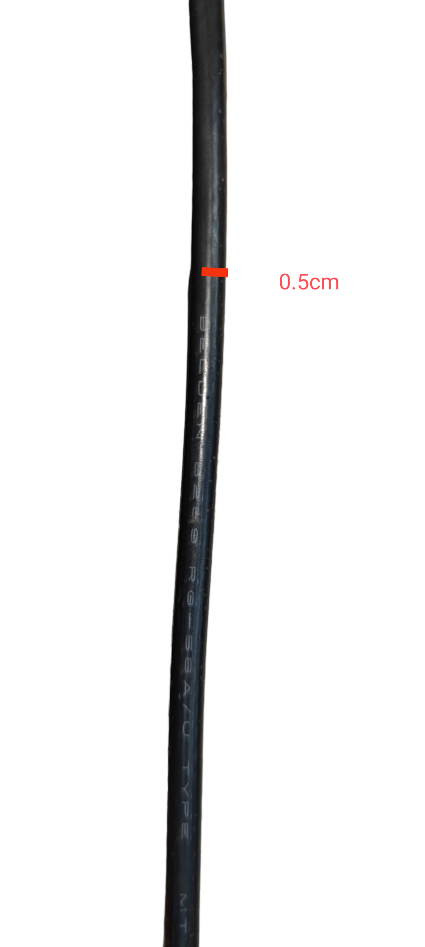 Belden RG58 coaxial cable close-up showing black insulated wire with measurement marking