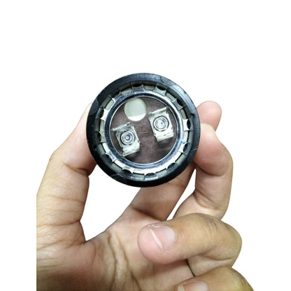 BMI Starting Capacitor 21-25MFD 330V held in hand for easy installation in motors