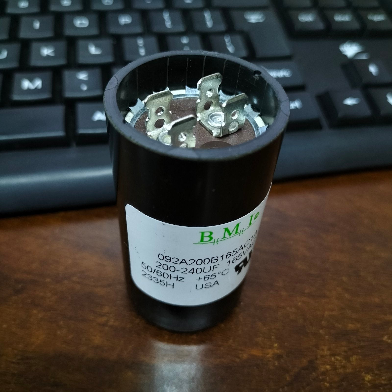 BMI 200-240MFD motor start capacitor with metal connectors and black casing for electrical applications