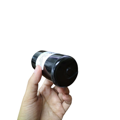 BMI 280-366UF 250V AC start capacitor held in hand, ideal for electrical applications.