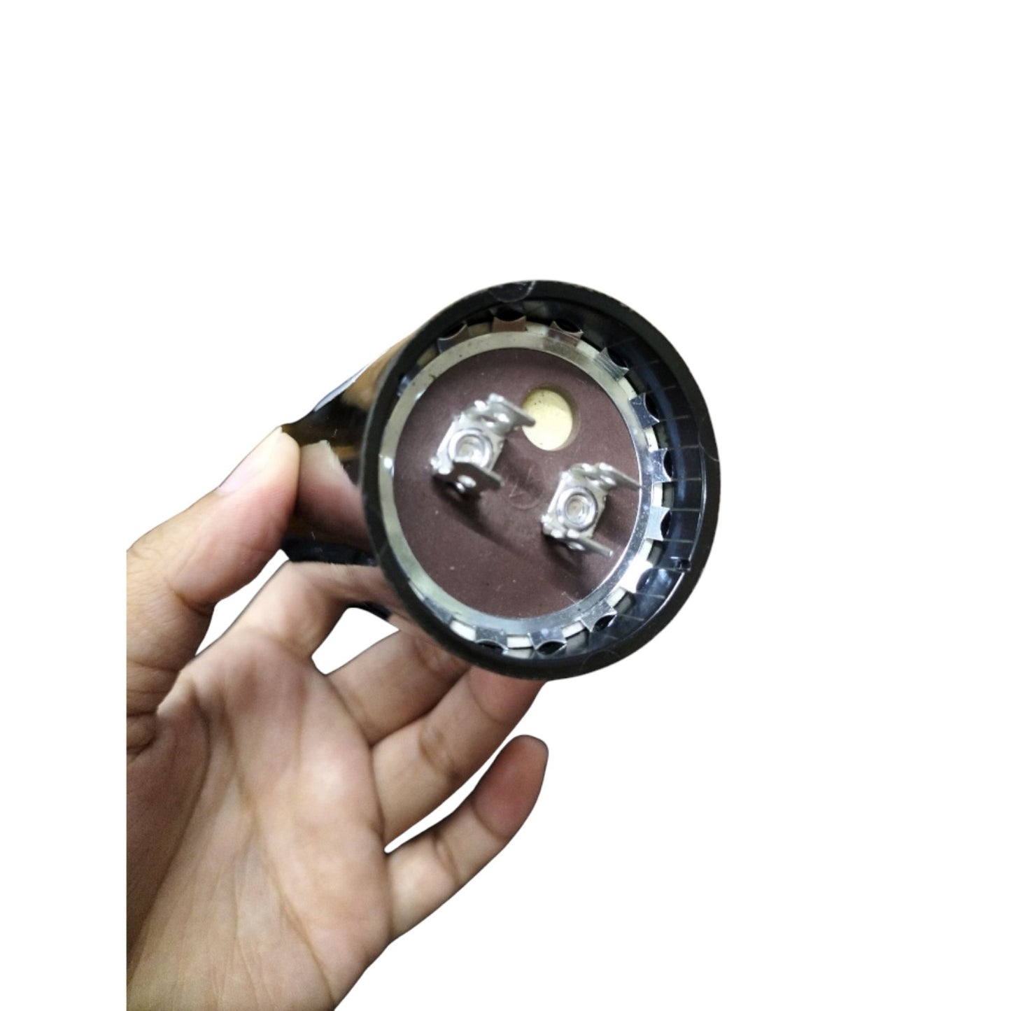 BMI starting capacitor 161-193UF 250V AC with terminal connections displayed in hand