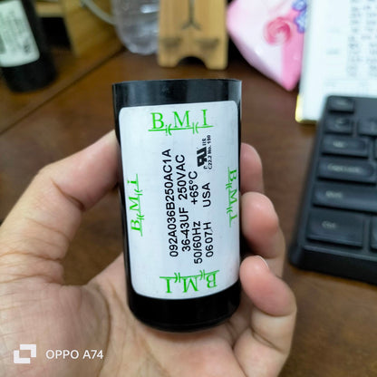 BMI Starting Capacitor 36-43 UF held in hand showing specifications and rating details
