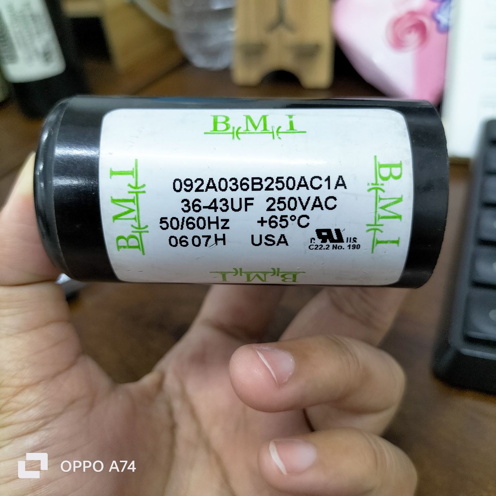 BMI Starting Capacitor 36-43 UF 250VAC 50-60Hz electrical circuitry part held in hand