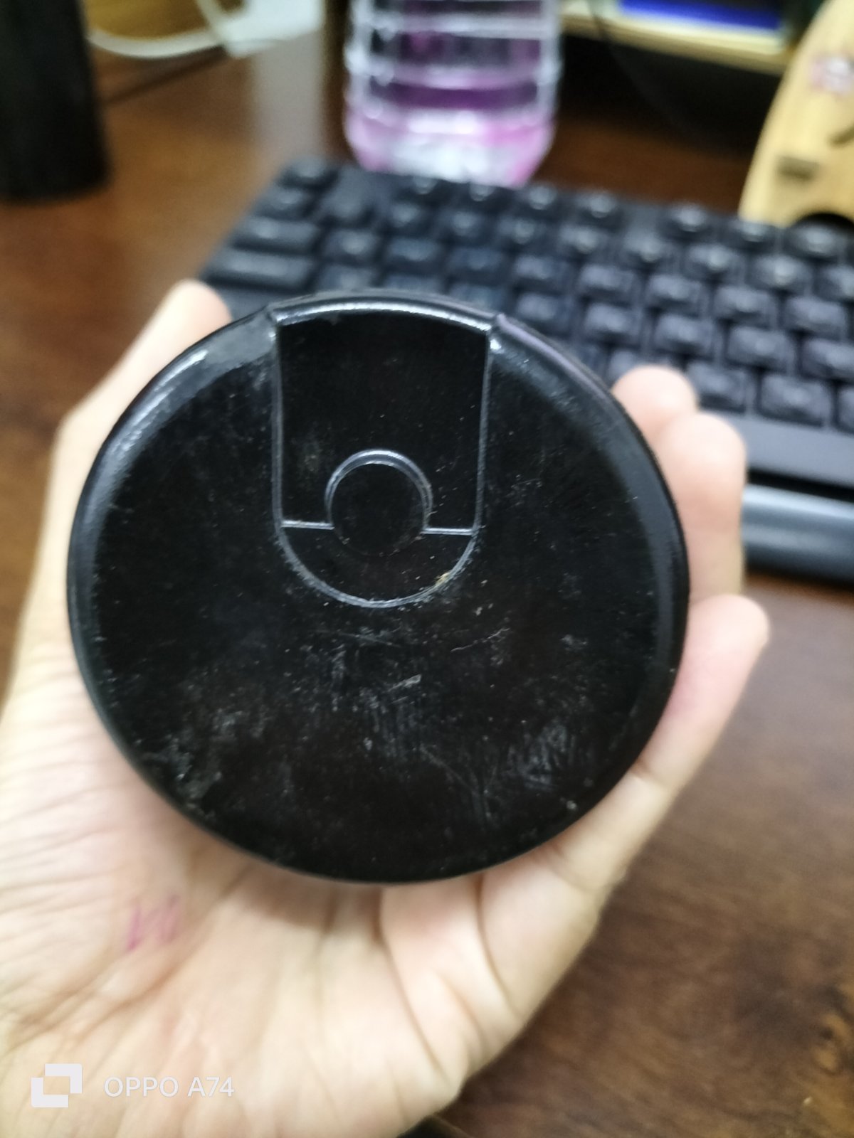 BMI starting capacitor 378-454UF round black electrical circuitry part held in hand