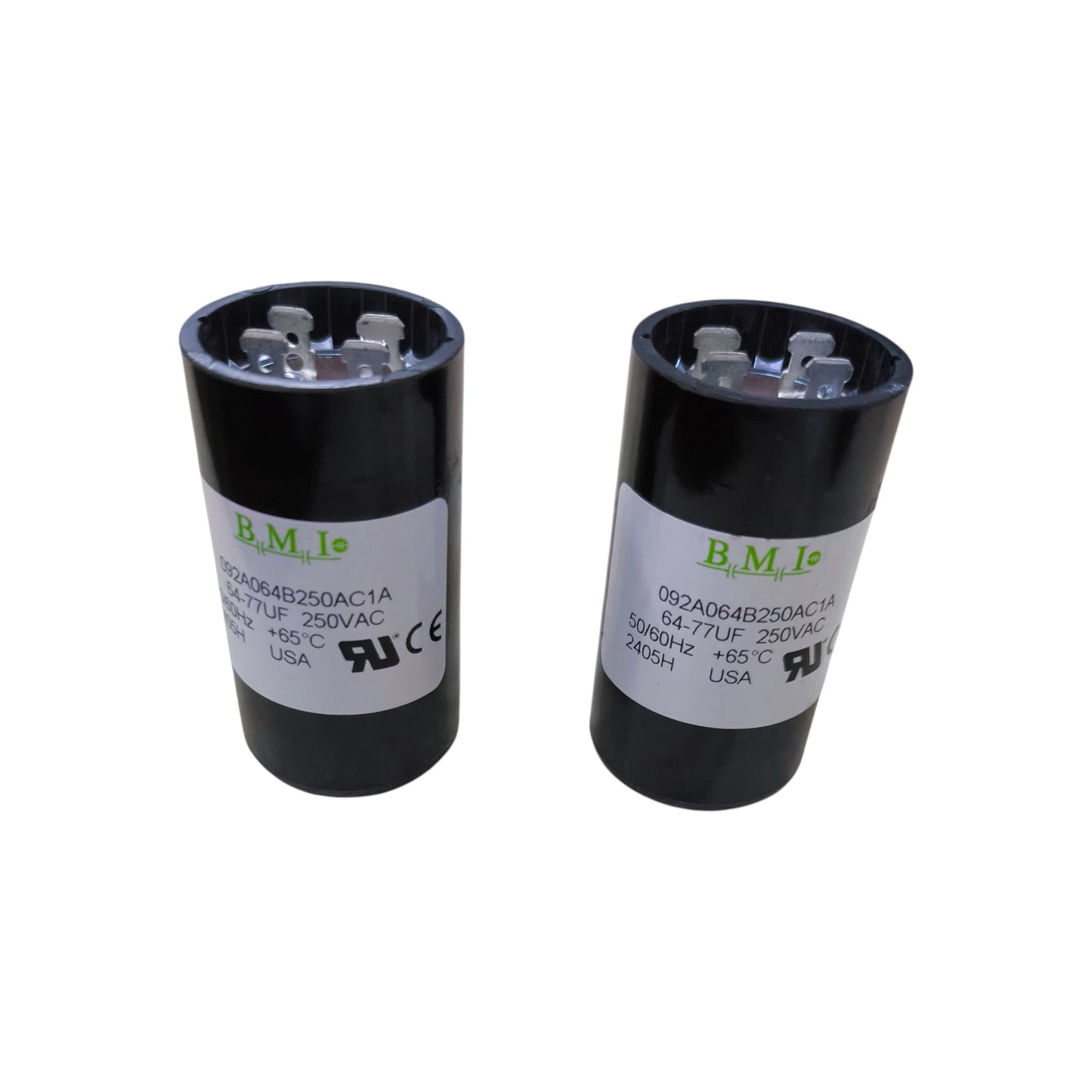 Two BMI Starting Capacitor 64-77MFD 250V black cylindrical motor start capacitors with terminals and labels