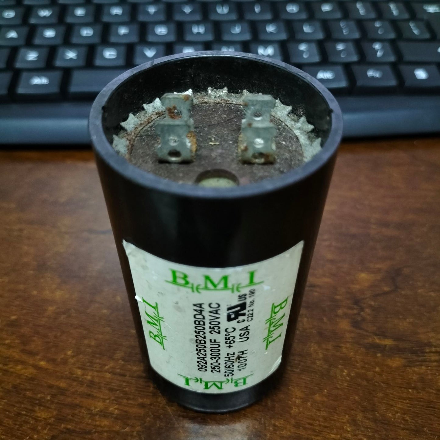 BMI 250-300uF Starting Capacitor for electrical circuits, featuring durable design and multiple connectors