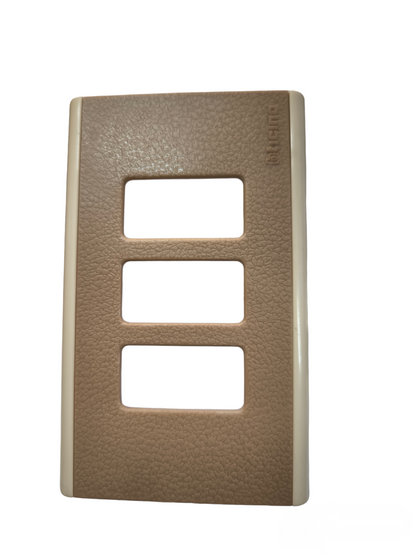 Bticino switch plate cover in brown textured finish with three rectangular openings