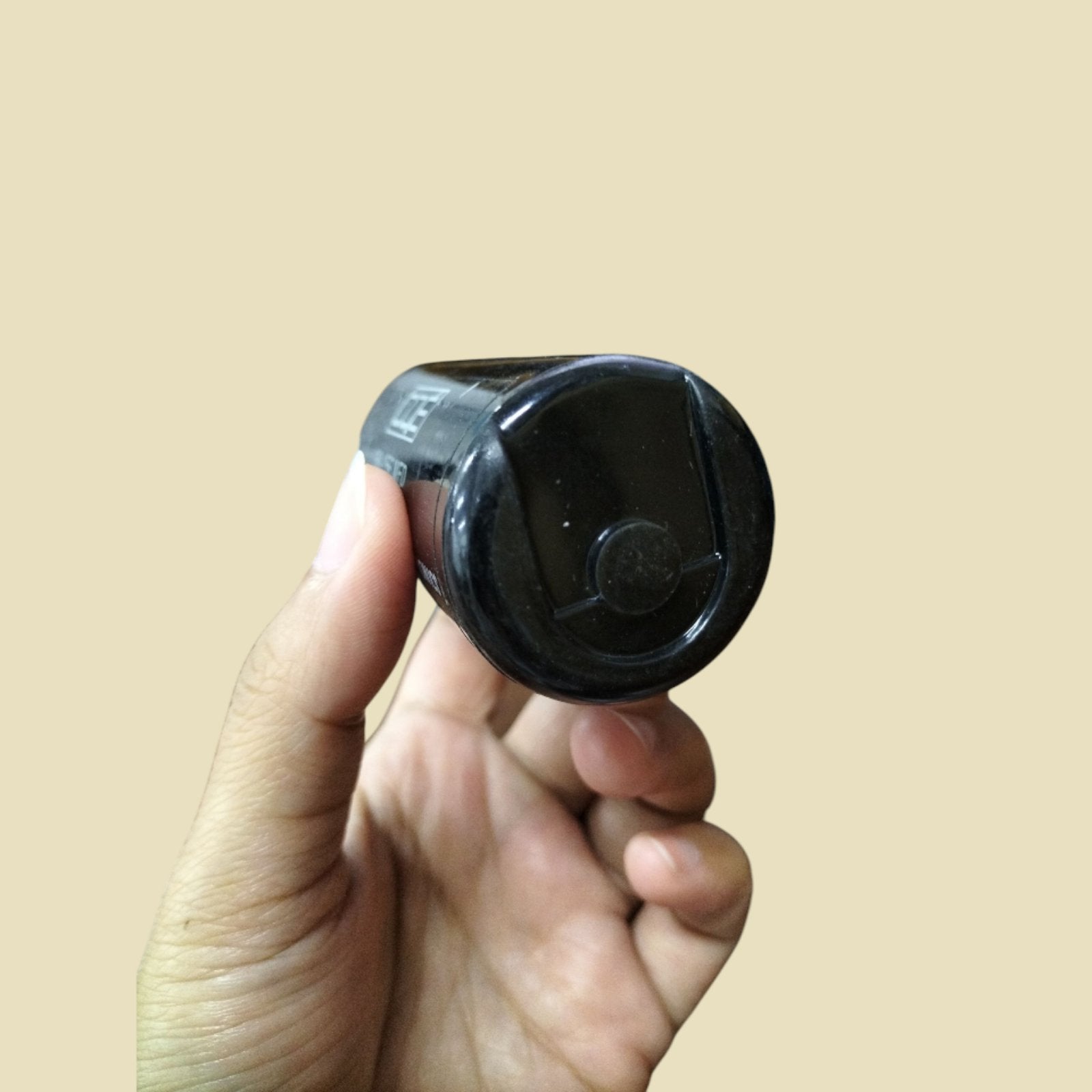 CDE electrical capacitor 110-125V held in hand showcasing its sleek design and compact size