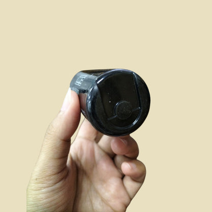 CDE electrical capacitor 110-125V held in hand showcasing its sleek design and compact size